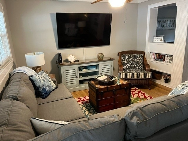 This spacious living room offers a cozy retreat with soft sofas, vibrant décor, and a perfect setting for movie nights or casual conversation.