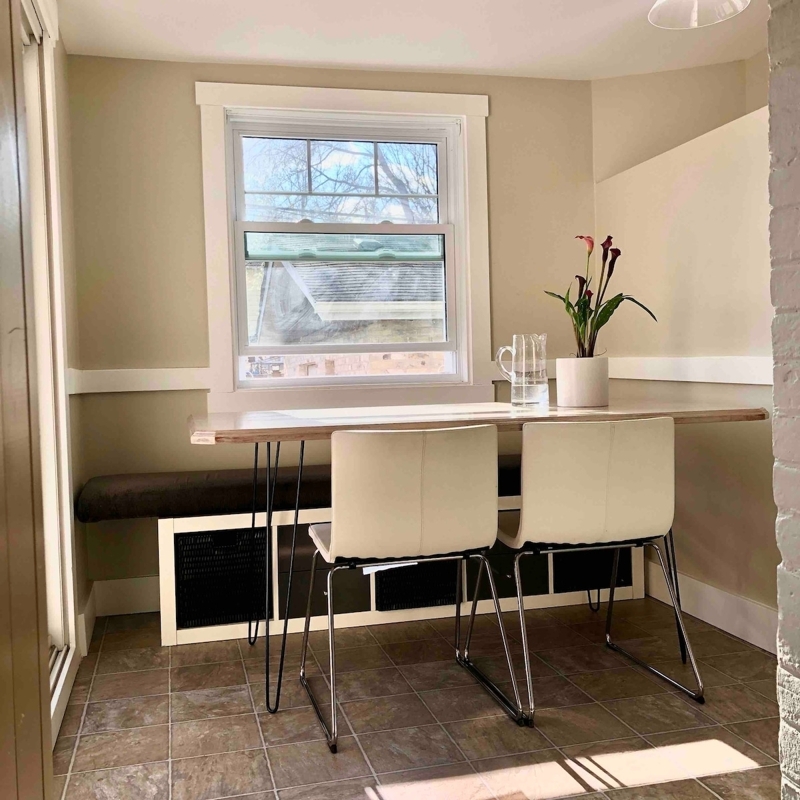 Breakfast nook overlooking rear yard and deck