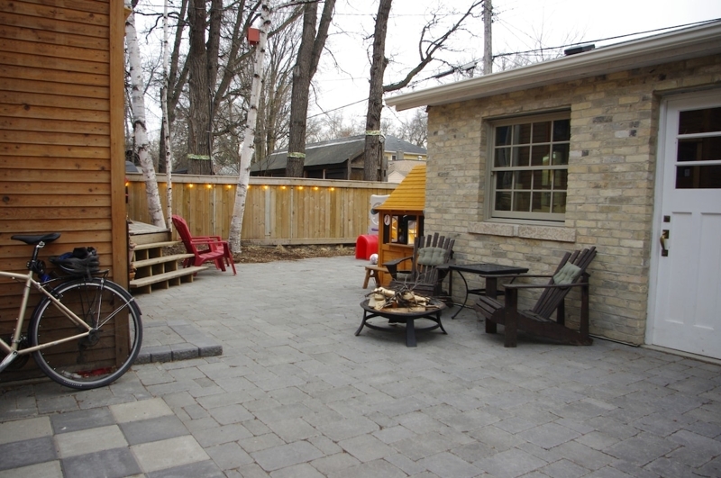 Rear yard, fully fenced, fire pit, dinner table and chairs. 