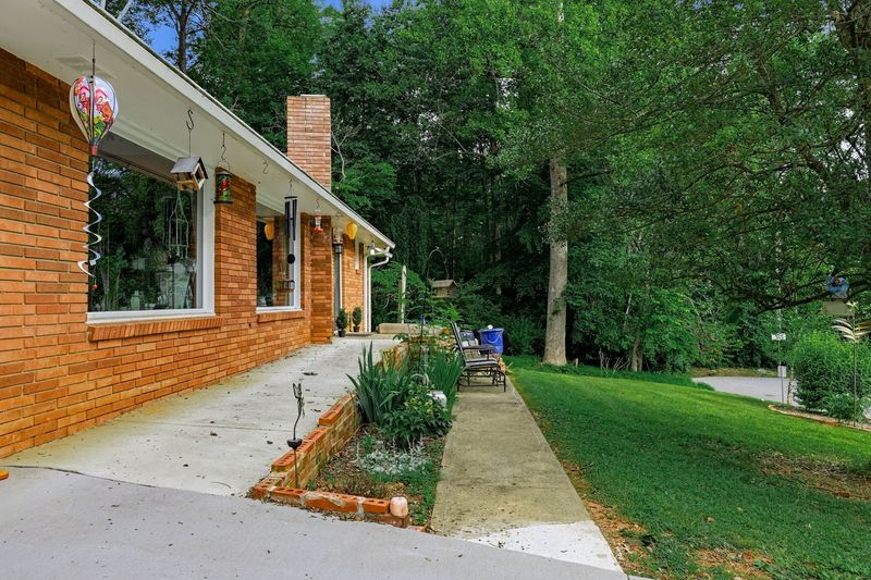 Accessible walkway and entrance with additional seating off the front path.
