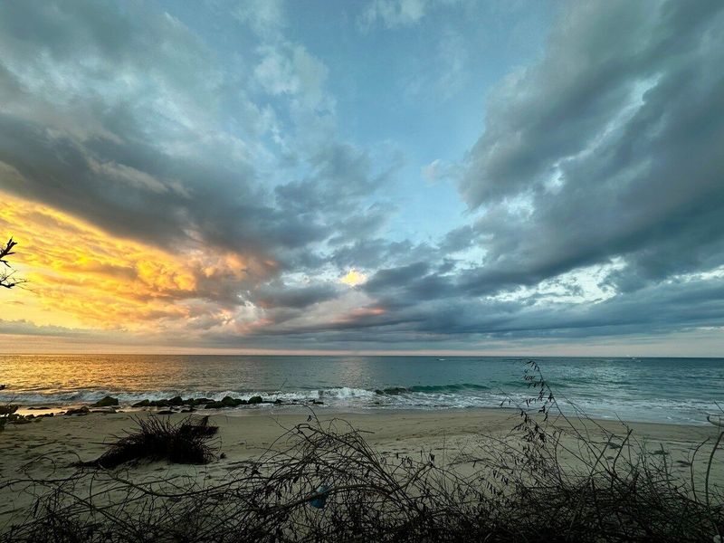 Panoramic view of beach at sunset 