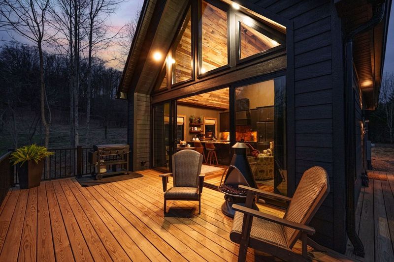 Front porch area with propane fireplace makes it easy to stay cozy while watching the sunset. 