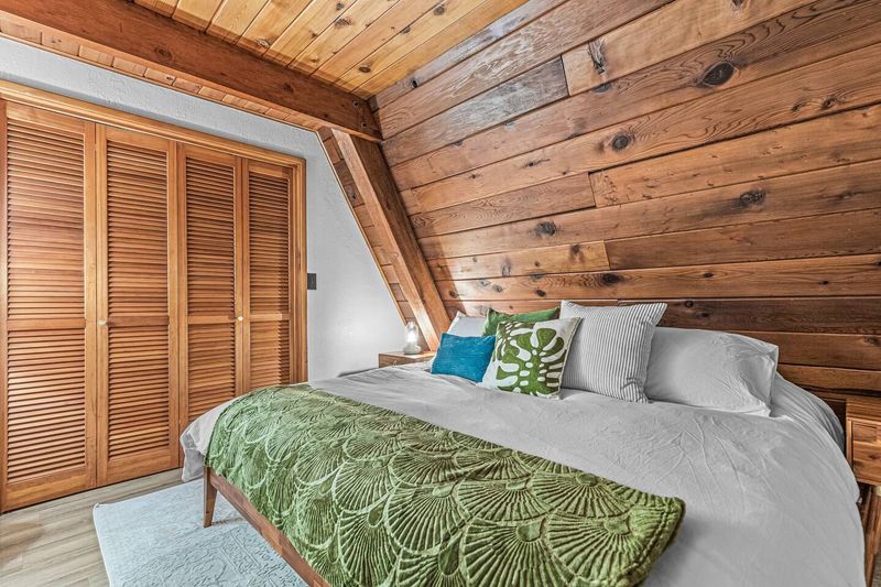Downstairs bedroom with king bed, memory foam mattress, and memory foam pillows.