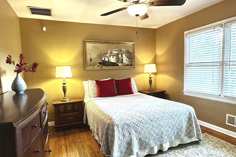 The 2nd bedroom offers a queen sized bed, dedicated workspace and ample closet & drawer space