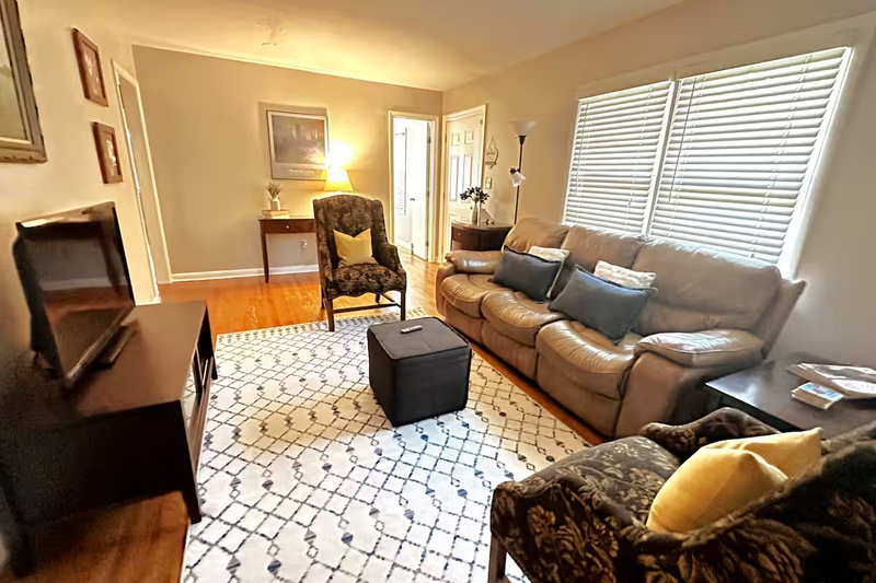 Separate living Room has a comfy leather sofa, flat screen TV, DVD player and a collection of DVD's for movie nights!