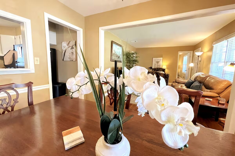 Dining room overlooking the living room and entrance to kitchen