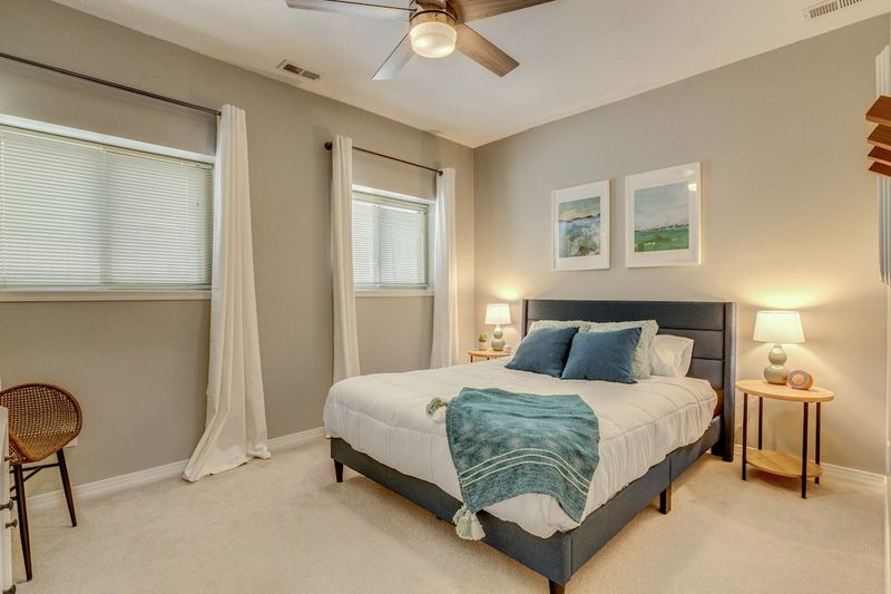 Queen bedroom with ceiling fan