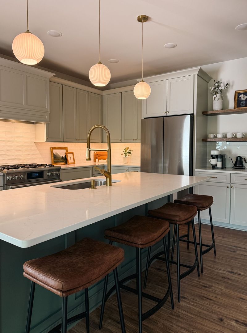 Stylish chef’s kitchen with quartz island, bar seating, and warm designer touches