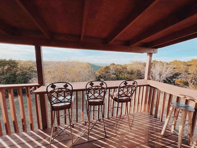 Breathtaking views from the upstairs balcony with seating for 8 people 