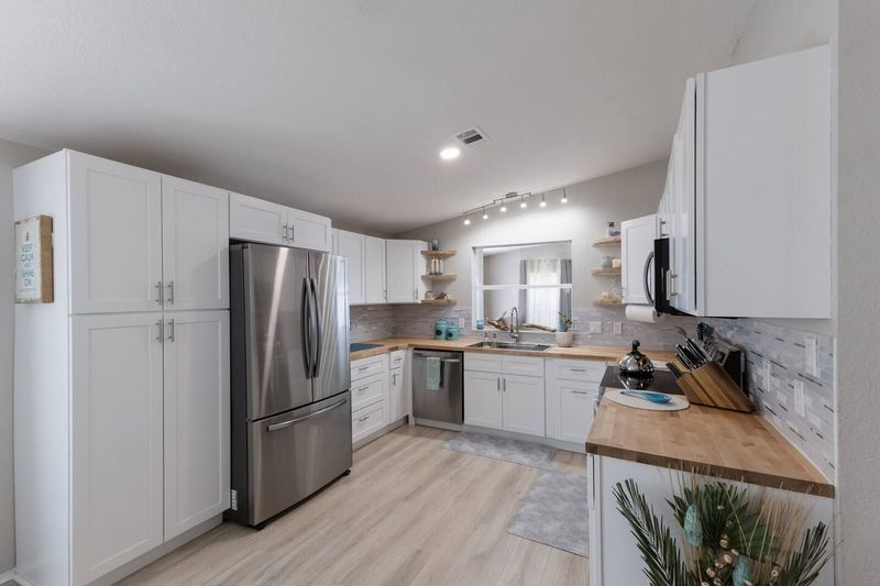 The fully remodeled U-shaped kitchen is stocked with cookware, dishes, and essentials for home-cooked meals. Enjoy complimentary starter coffee with both drip and single-serve coffee makers before heading out to explore.