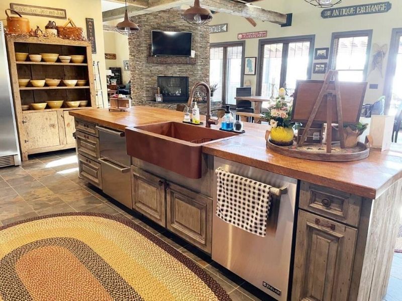 Kitchen with full fridge, freezer drawers, coffee bar, copper farm house sink and views of the lake.