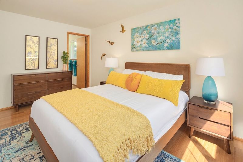The master bedroom offers a queen bed and direct access to the master bathroom