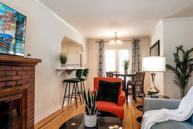 Living room with dining area and breakfast bar.