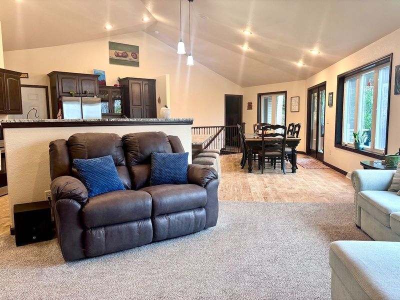 Our open concept features high vaulted ceilings & large windows, filling the home with natural light & providing views of the wooded ravine. Whether you're relaxing indoors or enjoying the outdoor scenery, you'll be surrounded by the beauty of nature