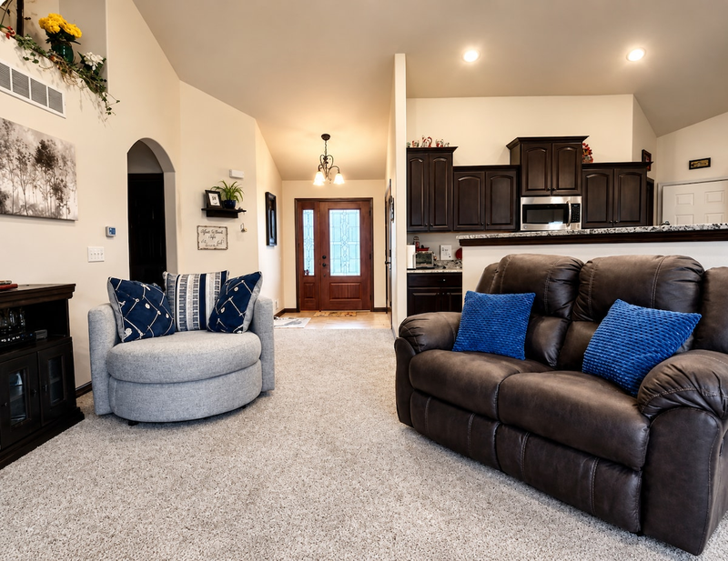 Whether you’re relaxing in the double reclining loveseat or pod chair, the open living room area welcomes you with its spacious layout, providing ample room for relaxation & entertainment. The large front foyer closet offers convenient storage