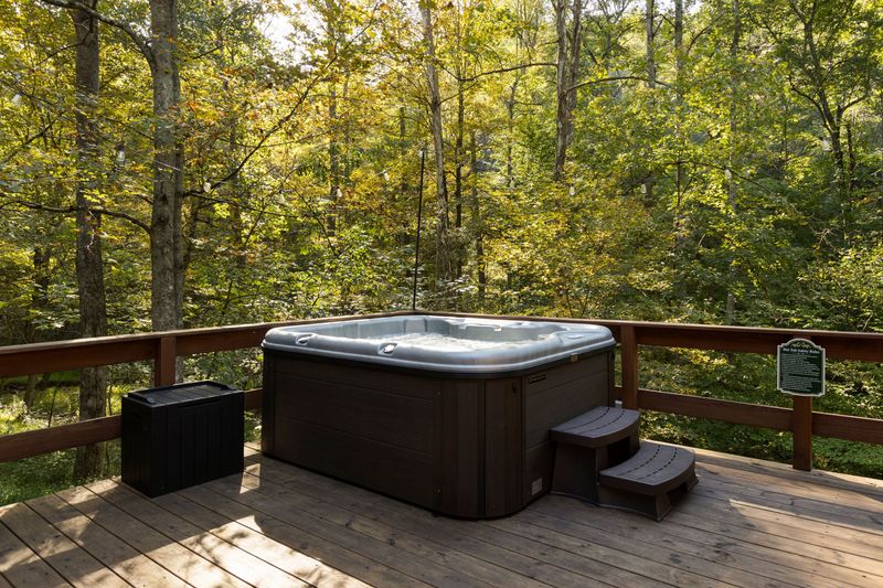 Private forest-view hot tub on a peaceful, spacious deck