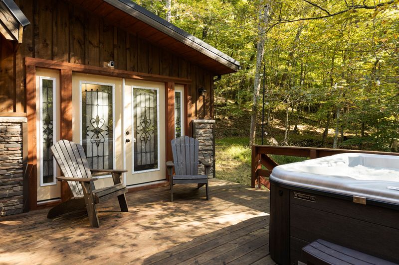 Private hot tub deck surrounded by peaceful woods