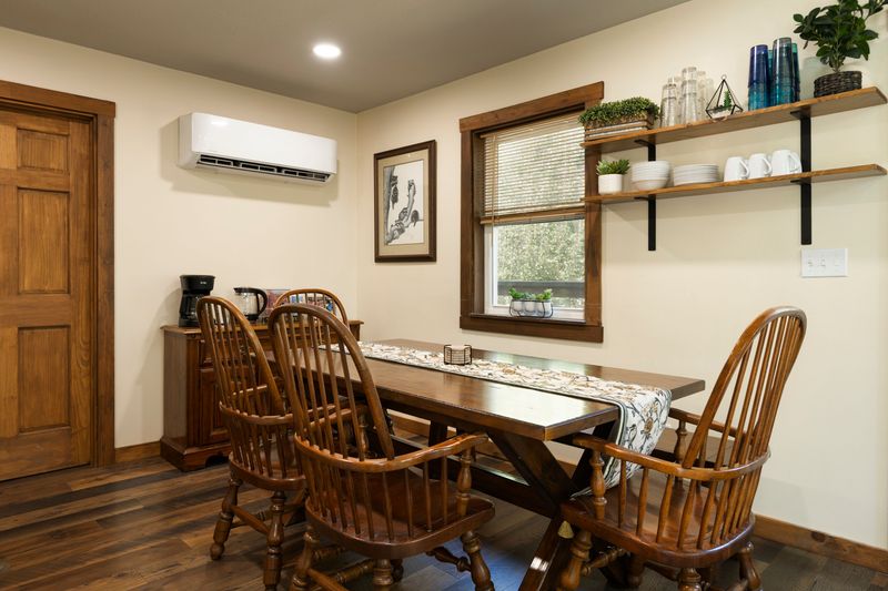 Cozy rustic dining nook with coffee station and sunny window views